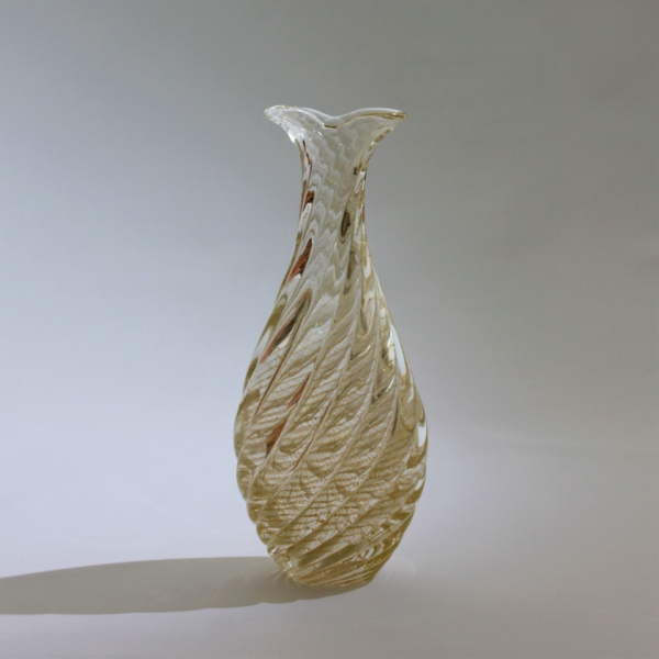 <em><b>Flavio Poli</b><br />Vase "Incrociato Oro"<br />Italy 1958</em> Flavio Poli, vase "Incrociato Oro", manufactured by Seguso Vetri d'Arte, Murano, Italy c. 1958. Colorless overlay glass, spirally ribbed body with fused, vertically ribbed gold foil.